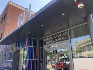 Roslindale Library entrance with colorful metal slat design.